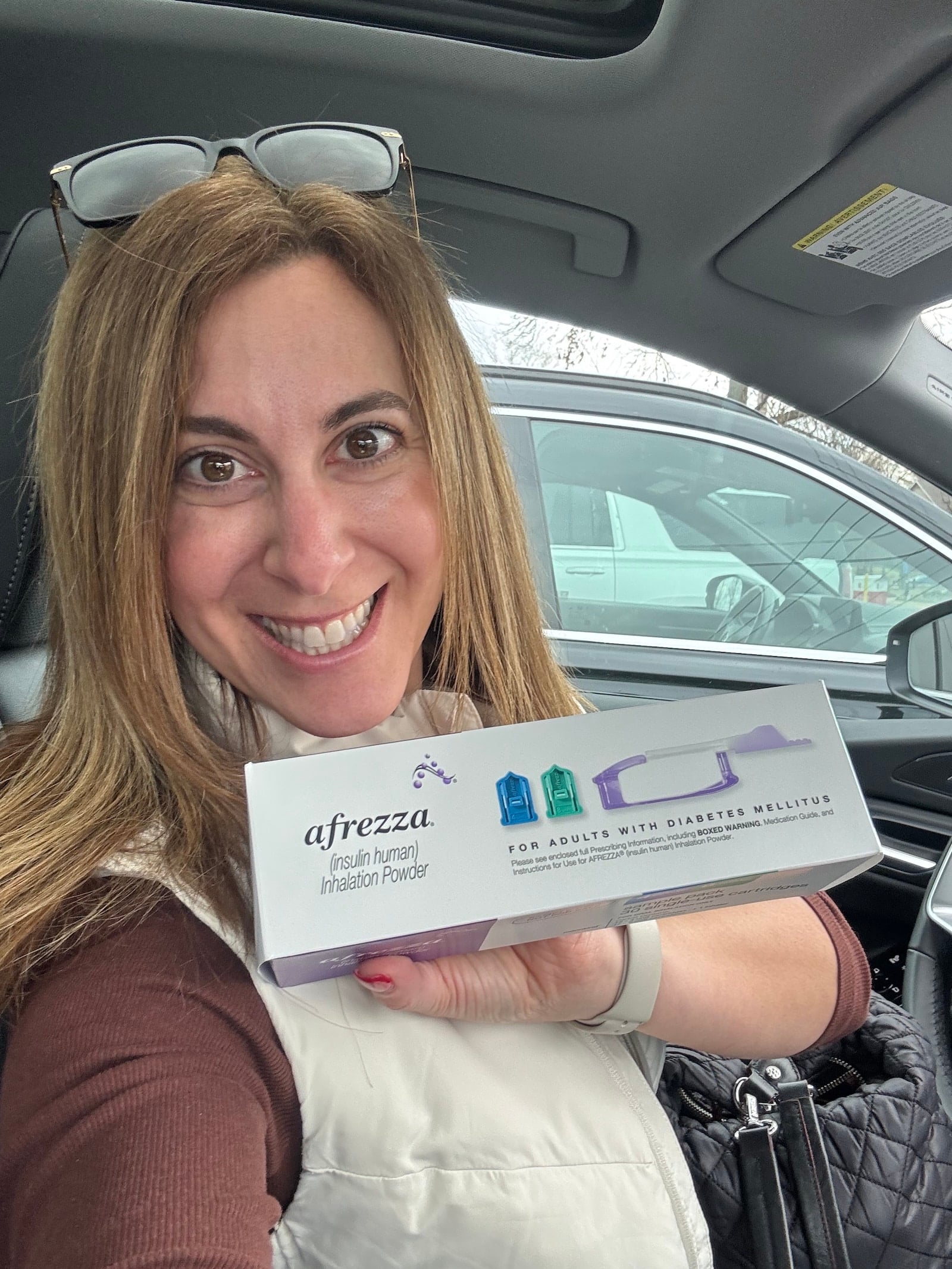 Image of Lindsay Cohen RD, LD, CDCES holding Afrezza sample